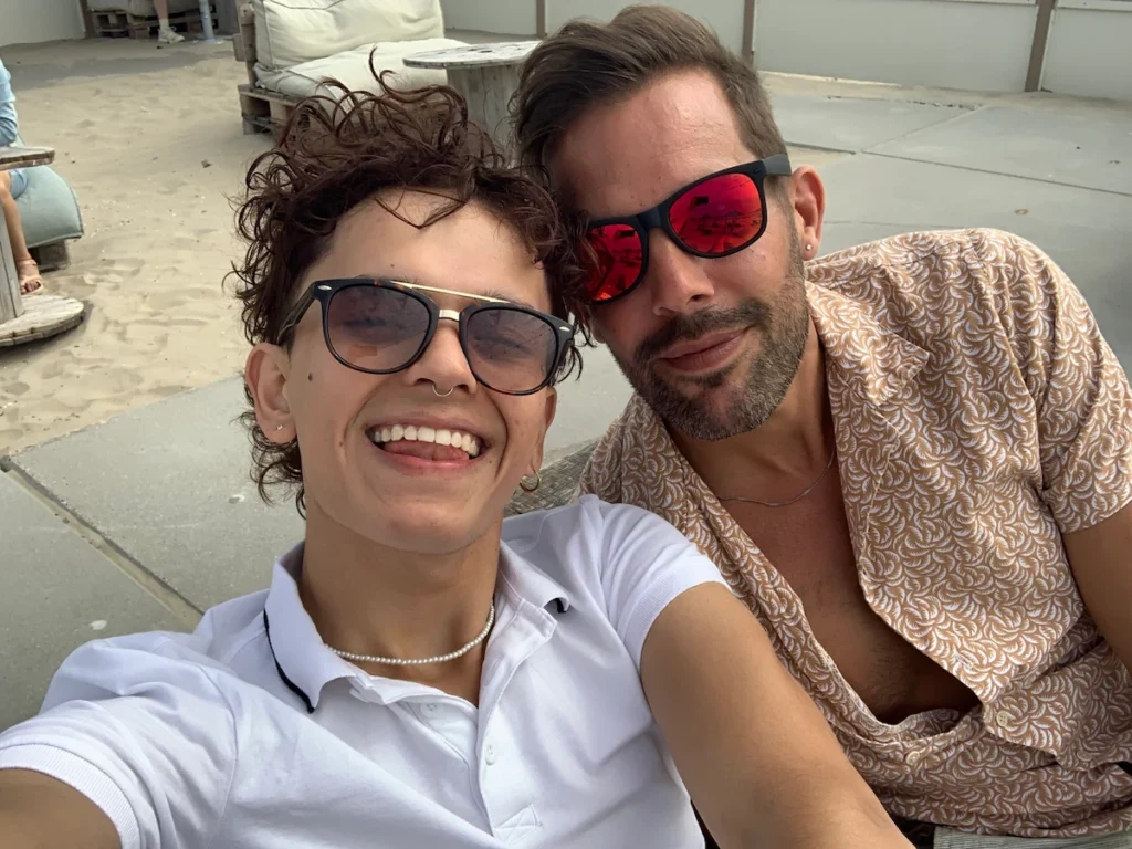 Lars and Sebas smiling together in Amsterdam during the summer of 2024.