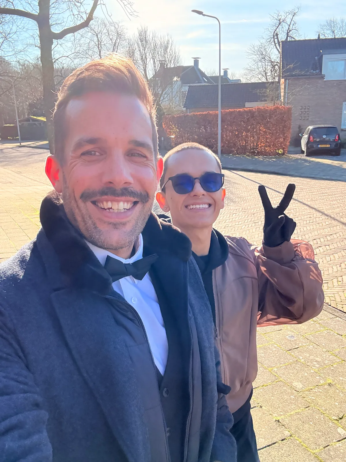 Lars and Sebas smiling together on a sunny winter day in the Netherlands.