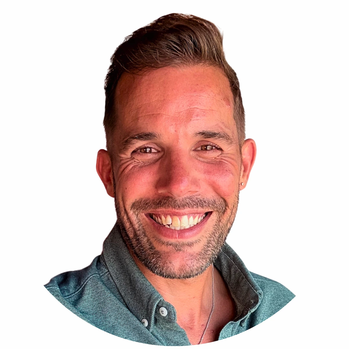 Portrait of Lars Brunnhoff, writer and author of How (Not To) Begin Your Dream Life, smiling and wearing a green shirt